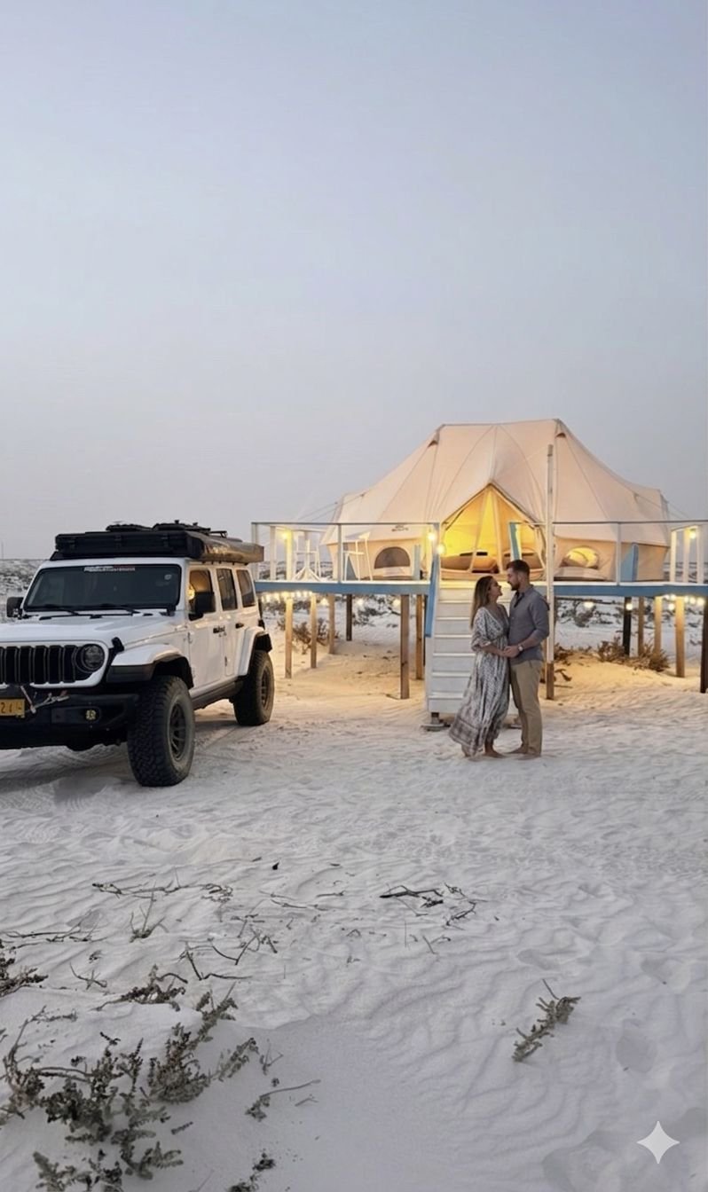 AlleyEscape four-wheel-drive vehicles beside an Oman coastal camp